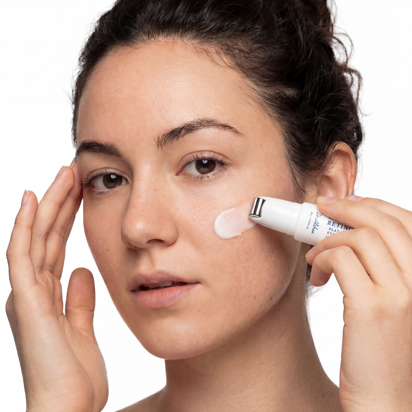 Eye anti-aging roller and lightweight serum formulation

Close-up of roller detail with reflective metal finish

Eye roller massage tool for puffiness and dark circles

Arcalo eye treatment serum drop beside applicator